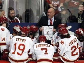 Denver coach Jim Montgomery talks to his team during the third period of the NCAA Frozen Four championship college hockey game, against Minnesota-Duluth, Saturday, April 8, 2017, in Chicago. Denver won 3-2.