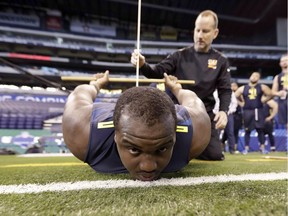 Mississippi State offensive-lineman Justin Senior is measured for flexibility at the NFL football scouting combine Friday, March 3, 2017, in Indianapolis.