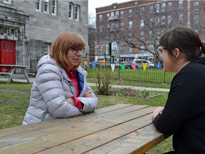 Katie McGroarty, right, communications co-ordinator for the NDG Food Depot, speaks with depot director of development Bonnie Soutar in the green space next to Trinity Memorial Church on Tuesday, April 25, 2017. A motion by councillor Peter McQueen aims to allow for the purchase of Côte-des-Neiges–N.D.G. church green space such as Trinity's for use as mini parks.