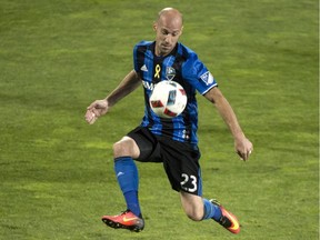 Montreal Impact defender Laurent Ciman chests the ball as they face the Orlando City FC in MLS action Sept. 7, 2016, in Montreal.