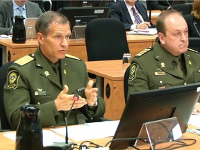 Martin Prud'homme, left, director general of the Sûreté du Québec, testifies at the Chamberland Commission in Montreal on Monday, April 10, 2017, with André Goulet, right, the SQ's chief inspector of criminal investigations.