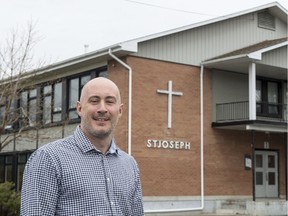 Martin Thibert, mayor of Saint-Sébastien, is seen in front of St-Joseph campus of Capitaine-Luc-Fortin elementary school Friday, April 21, 2017 in Saint-Sebastien, Que. Thibert was almost finished painting the interior of his kids' public school with the help of a group of volunteers when an inspector showed up. The provincial construction inspector told the gathering of parents, grandparents and teachers that painting a school for free, and without the proper licence, is illegal in Quebec.