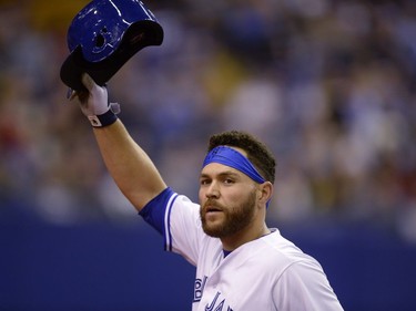 Toronto Blue Jays' catcher Russell Martin acknowledges applause after he was lifted from the game after hitting a fifth inning single against the Pittsburgh Pirates during preseason MLB action in Montreal on Saturday, April 1, 2017.