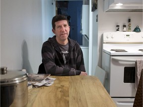 Mathieu Proulx is seen in his apartment Wednesday, November 30, 2016 in Montreal. Mathieu Proulx, who earns $13.50 an hour as a maintenance worker in Montreal's Old Port, says he sometimes feels like he's surviving rather than living.