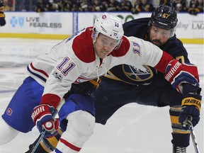 Montreal Canadiens forward Brendan Gallagher (11) skates past Buffalo Sabres defenseman Zach Bogosian (47) during the second period of an NHL hockey game, Wednesday in Buffalo, N.Y.