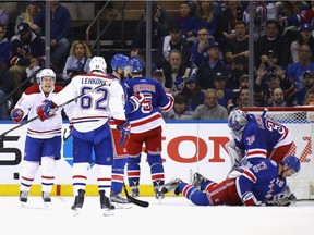 Brendan Gallagher #11 of the Montreal Canadiens moves in to congratulate Artturi Lehkonen #62 on his powerplay goal at 17:37 of the second period against Henrik Lundqvist #30 of the New York Rangers in Game Three of the Eastern Conference First Round during the 2017 NHL Stanley Cup Playoffs at Madison Square Garden on April 16, 2017 in New York City.