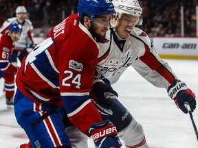 Montreal Canadiens' Phillip Danault (24) and Washington Capitals defenceman John Carlson (74) tangle in the corner at the Bell Centre in Montreal, on Monday, January 9, 2017.