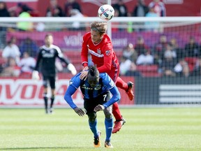 Joao Meira #66 of Chicago Fire fouls Dominic Oduro #7 of Montreal Impact in the second half during an MLS match at Toyota Park on April 1, 2017 in Bridgeview, Illinois.