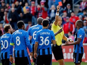 Victor Cabrera #36 of Montreal Impact receives a red card for denying an obvious goal scoring opportunity by referee Ismail Elfath during the second half of their game against the Chicago Fire at Toyota Park on April 1, 2017 in Bridgeview, Illinois. The match ended in a 2-2 draw.
