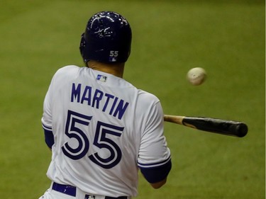 Toronto Blue Jays' Russell Martin loads the bases after being hit in the 2nd inning of the preseason game against the Pittsburgh Pirates at Olympic Stadium in Montreal, on Saturday, April 1, 2017.