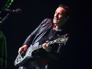 Def Leppard guitar player Vivian Campbell leans into a solo during concert in Montreal Monday April 10, 2017.