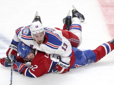 Montreal Canadiens Artturi Lehkonen gets laid on by New York Rangers Kevin Hayes during 2nd period of game 1 of the first round of the NHL playoffs in Montreal Wednesday April 12, 2017.