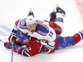 Canadiens Artturi Lehkonen is flattened by Rangers' Kevin Hayes Wednesday nght at the Bell Centre.