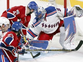 Canadiens Alexander Radulov has the puck in front of Rangers goalie Henrik Lundqvist just before scoring winning goal in overtime Friday night at the Bell Centre.