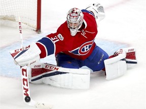 Canadiens' Carey Price makes a stick save during second period of the second game of round one of National Hockey League playoff series against the New York Rangers in Montreal on Friday, April 14, 2017.