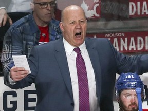 Canadiens head coach Claude Julien argues with a referee behind Paul Byron during the second period of the second game of round one of the National Hockey League playoff series against the New York Rangers in Montreal on Friday, April 14, 2017.