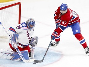 Rangers goalie Henrik Lundqvist stops Canadiens captain Max Pacioretty during third period Friday night at the Bell Centre.