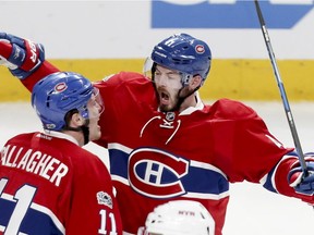 Canadiens' Paul Byron celebrates his goal with teammate Brendan Gallagher during Game 2 of playoff series against the New York Rangers in Montreal on April 14, 2017.