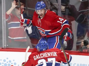 Canadiens Tomas Plekanec celebrates his game-tying goal with Alex Galchenyuk en route to the Habs' 4-3 overtime win over the Rangers Friday night at the Bell Centre.