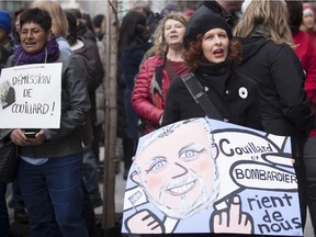 Demonstrators protest against Bombardier and Quebec Premier Philippe Couillard outside the planemaker's headquarters on René Lévesque Blvd. in Montreal on Sunday, April 2, 2017.