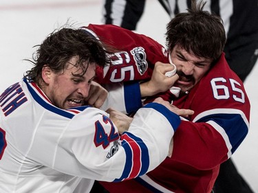 Montreal Canadiens centre Andrew Shaw (65) and New York Rangers defenceman Brendan Smith (42) duke it out during 1st period action of game 5 of the playoffs at the Bell Centre in Montreal, on Thursday, April 20, 2017.