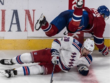 Montreal Canadiens defenceman Alexei Emelin (74) flies over New York Rangers left wing Chris Kreider (20) and into the boards during 2nd period action of game 5 of the playoffs at the Bell Centre in Montreal, on Thursday, April 20, 2017.