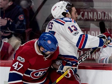 Montreal Canadiens right wing Alexander Radulov (47) checks New York Rangers right wing Kevin Hayes (13) into the boards during 1st period action of game 5 of the playoffs at the Bell Centre in Montreal, on Thursday, April 20, 2017.