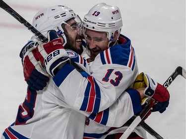New York Rangers centre Mika Zibanejad (93) is congratulated by right wing Kevin Hayes (13) after scoring the overtime goal to defeat the Montreal Canadiens 3-2 in game 5 of the playoffs at the Bell Centre in Montreal, on Thursday, April 20, 2017.