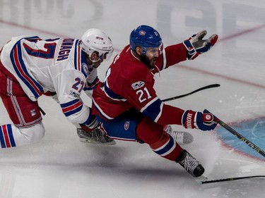 New York Rangers defenceman Ryan McDonagh (27) gets 2 minutes for slashing the stick of Montreal Canadiens left wing Dwight King (21) in front of New York Rangers goalie Henrik Lundqvist (30) during 2nd period action of game 5 of the playoffs at the Bell Centre in Montreal, on Thursday, April 20, 2017.