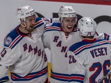 New York Rangers defenceman Brady Skjei (76) is congratulated by teammates New York Rangers right wing Kevin Hayes (13) and left wing Jimmy Vesey (26) after scoring against the Montreal Canadiens during 2nd period action of game 5 of the playoffs at the Bell Centre in Montreal, on Thursday, April 20, 2017.