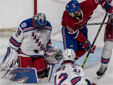 Rangers goalie Henrik Lundqvist makes the save with Canadiens' Andrew Shaw on the doorstep Thursday night. Shaw is one of many Canadiens forwards who has yet to score in the series.
