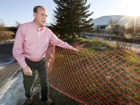 Paul Goudreault is among the Laval residents who are concerned that the opening of Place Bell will exacerbate the parking chaos in their neighbourhood. He shows a construction fence that he says has been broken down by people who park in the area and then go to the Montmorency métro or other nearby sites.