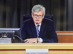 Justice Jacques Chamberland delivers his opening remarks on the opening day of  the Commission of Inquiry on the Protection and Confidentiality of Journalistic Sources in Montreal, Monday, April 3, 2017.