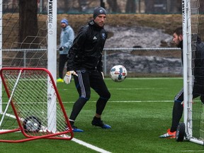 Montreal Impact goalkeeper Evan Bush, left, practises in the rainy weather in Montreal, on Tuesday, April 4, 2017, before heading to Los Angeles for a match against the Galaxy.