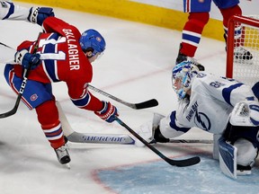 Lightning goalie Andrei Vasilevskiy tips the puck away from Canadiens' Brendan Gallagher during NHL action at the Bell Centre in Montreal on Friday April 7, 2017.