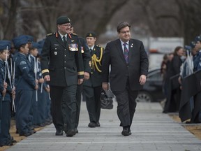 Brigadier-General Hercule Gosselin, left, and Montreal mayor Denis Coderre, right, arrive for the Inauguration of the Place de Vimy at Notre-Dame-de-Grâce park in Montreal on Sunday, April 9, 2017.
