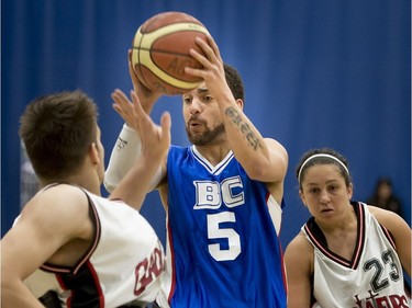 Laval Gladiators Vincent Dallaire tries to block the pass of B.C. Royals Deion Green.