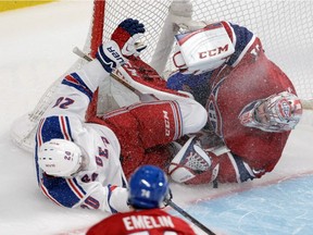 Montreal Canadiens goalie Carey Price is run into by Chris Kreider of the New York Rangers in the second period of the Eastern Conference final of the NHL playoffs at the Bell Centre in Montreal, on Saturday, May 17, 2014.