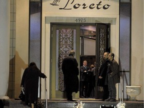 In this 2010 image, people enter the Loreto Funeral Complex for the visitation for Mafia figure Nicolo Rizzuto. (Peter McCabe / THE GAZETTE)