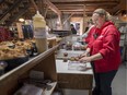 Stephanie Quinn works in the kitchen area packing muffins at Quinn Farm in October 2014.