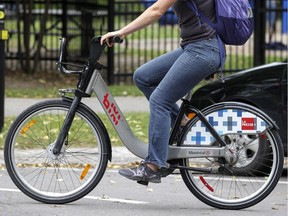 A cyclist rides a Bixi in Montreal on Sept. 29, 2015.