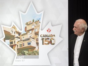 Architect Moshe Safdie looks at a new Canada Post stamp depicting his famous Habitat 67 housing complex to celebrate Expo 67 during its unveiling in Montreal, Thursday, April 27, 2017.