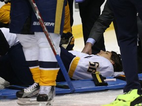 Kevin Fiala of the Nashville Predators lies on the ice after being injured against the St. Louis Blues in Game 1 of the Western Conference Second Round during the 2017 NHL Stanley Cup Playoffs at the Scottrade Center on April 26, 2017 in St. Louis, Missouri.
