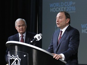 NHL commissioner Gary Bettman, right, and NHL Player's Association executive director Donald Fehr are seen in a January 2015 file photo.