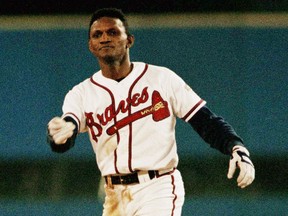 Atlanta Braves' Otis Nixon flips his helmet after he was caught stealing a second base in the seventh inning of game six of the World Series in Atlanta against the Toronto Blue Jays in 1992.