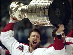 Patrick Roy holds the Stanley Cup aloft after the Canadiens won the Stanley Cup in 1993.