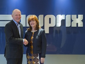 Uniprix Group President and CEO Philippe Duval shakes hands with McKesson Canada President Paula Keays at Uniprix offices in Montreal, Wednesday, April 12, 2017.