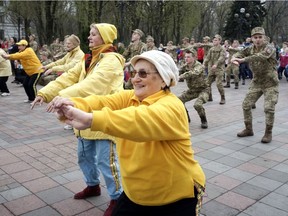 People celebrate World Health Day by exercising outdoors in Kiev, Ukraine, on April 7, 2017. Set a goal of spending at least 25 per cent of your weekly exercise minutes enjoying fresh air and natural light, Jill Barker recommends.
