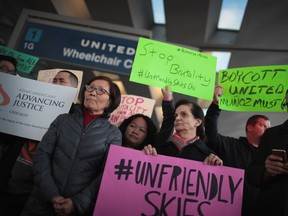 Demonstrators protest outside the United Airlines terminal at O'Hare International Airport on April 11, 2017 in Chicago, Illinois. United Airlines has been struggling to restore their corporate image after a cellphone video was released showing a passenger being dragged from his seat and bloodied by airport police after he refused to leave a reportedly overbooked flight.