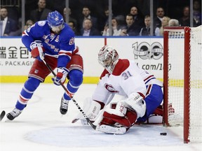 Rangers' Rick Nash puts puck past Canadiens goalie Carey Price for winning goal Tuesday night in New York.